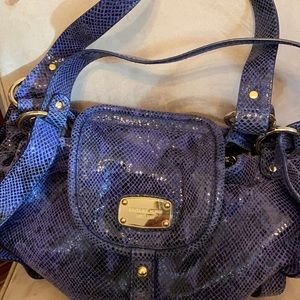 Michael Kors snake skin print Like new.  Used one time.  Lots of room inside